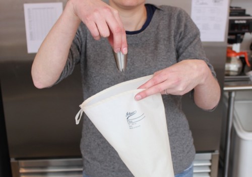 Drop your piping tip into the bag. 