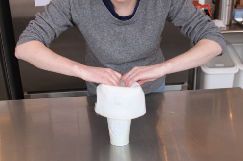 Curl the piping bag around the glass. 