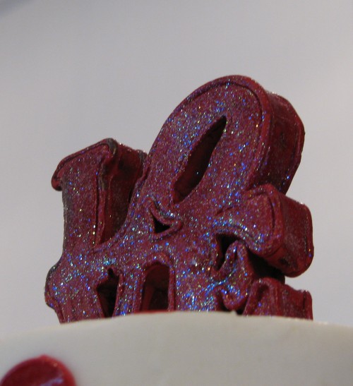 A look at the glittery LOVE cake topper.