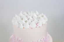 Meringues provided a decorative element to the top of the cake. Whipped Bakeshop cake for Smoochie Paper