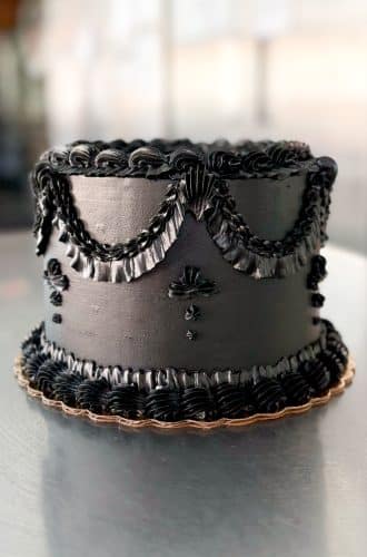 Vintage birthday cake with black icing by Whipped Bakeshop in Philadelphia, PA